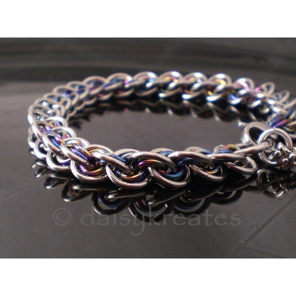 3x3 Wave Bracelet in stainless steel and rainbow anodized niobium