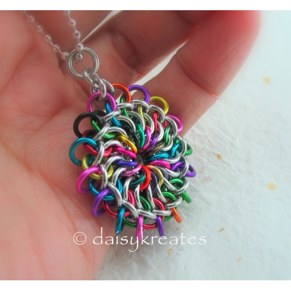 Chainmaille Mandala Pendant's colors reminiscent of Tibetan sand mandala