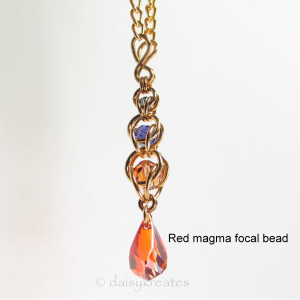 Golden Harvest Y necklace with red magma focal drop bead