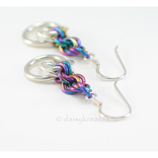 Beautiful Tea Rose earrings with soft glow of silver and colorful rainbow