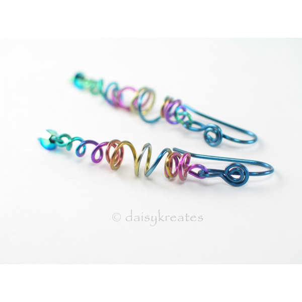 Organic stretch of coils offers unique play of shapes for these lively earrings