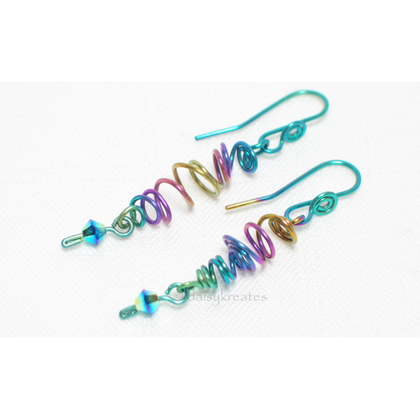 Freehand forming of the earrings ensures the organic look and feel of the sprite