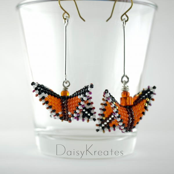Monarch butterfly earrings each with its own variations in patterns