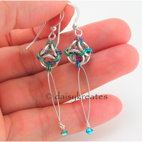 These pretty earrings are made of sterling silver, natural titanium, anodized ni