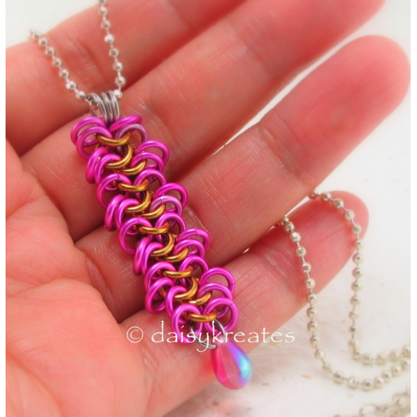 Hot pink anodized aluminum rings perfectly matched with the pink drop bead