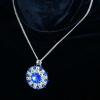 Sunburst medallion pendant with blue Swarovski rivoli and crystals beads