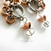Bronze foiled glass tulip beads dots the end of each earrings, adds movements