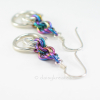 Beautiful Tea Rose earrings with soft glow of silver and colorful rainbow