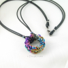 Pure niobium pendant anodized to include all spectrum of colors
