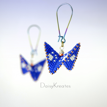 Blue and white paw print earrings in contemporary geometric style