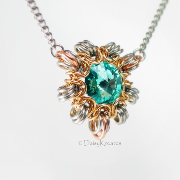 Byzantine Sun necklace with smaller pendant in Swarovski turquoise blue Byzantine Sun necklace with smaller pendant in Swarovski turquoise blue