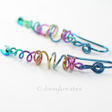 Organic stretch of coils offers unique play of shapes for these lively earrings